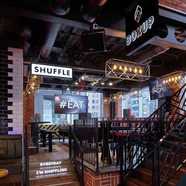 Modern BOX Deansgate venue with exposed brick, perfect for social gatherings and corporate events.