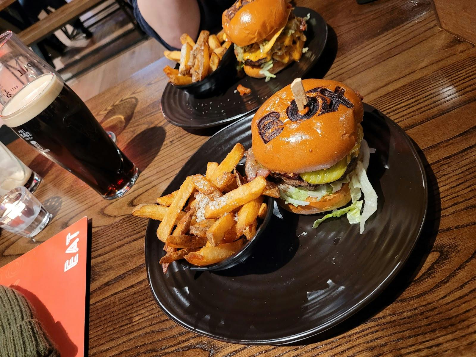 Gourmet burger and fries at Upstairs Bar for casual dining events in BOX Deansgate.