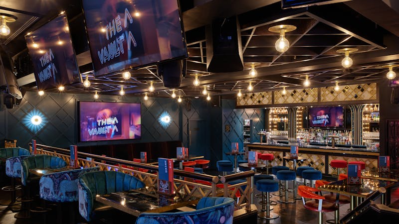 Modern Upstairs Bar at BOX Deansgate, vibrant event space for networking and celebrations.