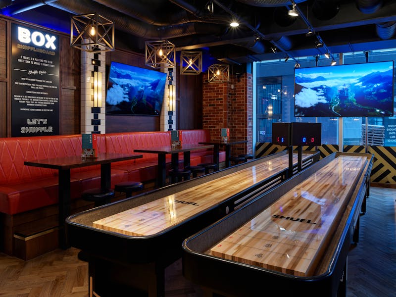 Upstairs Bar at BOX Deansgate: modern venue with bowling lanes for corporate events and gatherings.