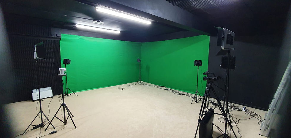 Versatile production studio with green screens for virtual events and video recordings.