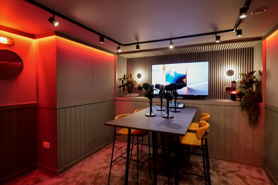 Modern meeting space at Imagine Media Network with vibrant lighting for creative sessions.