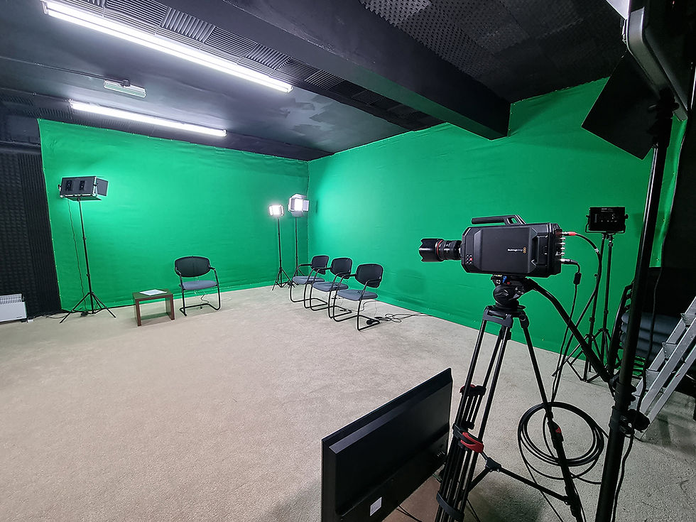 Website designer in green screen studio for virtual events and live-streaming.