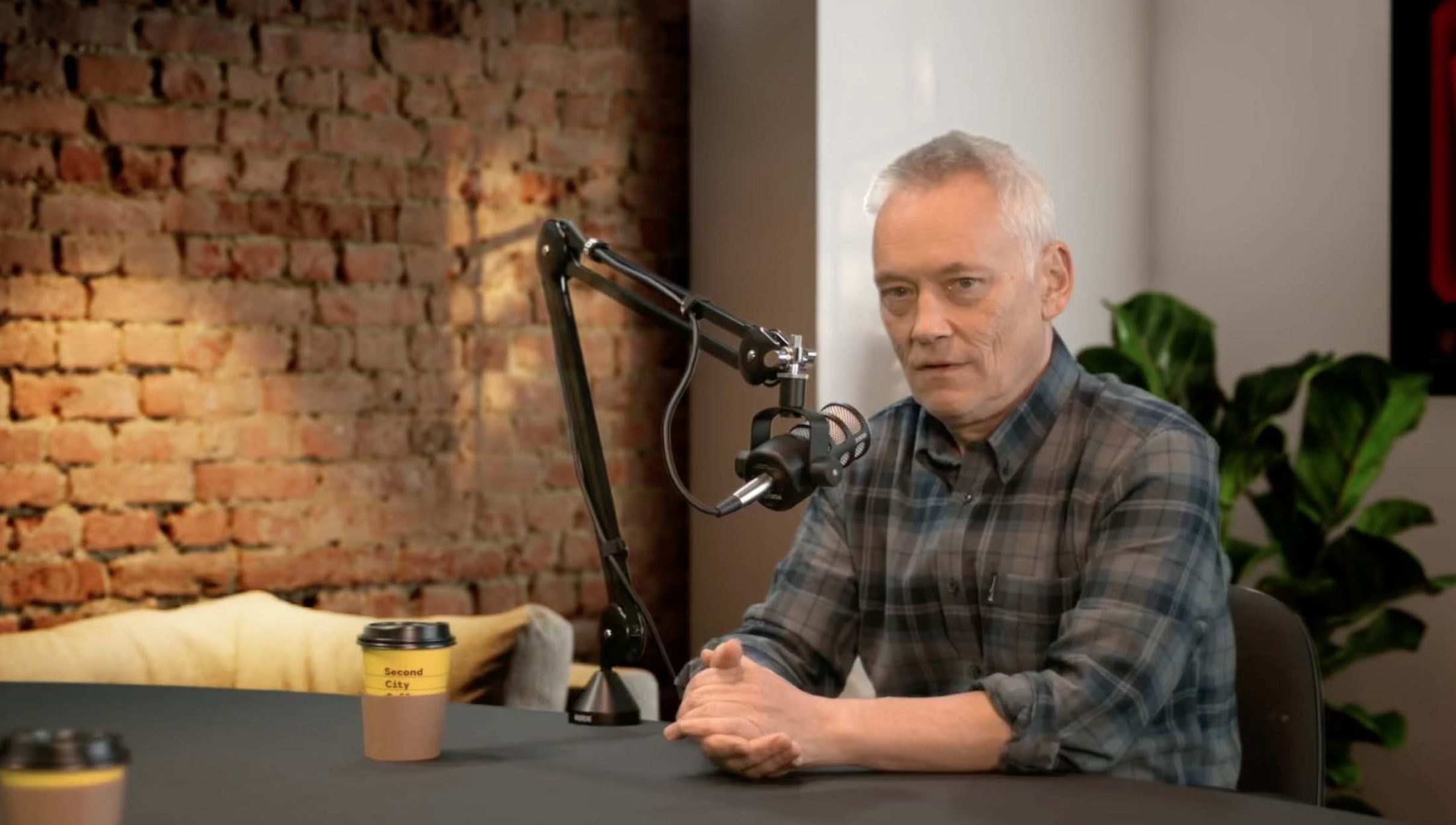 Podcast studio with sleek table, microphone, ideal for interviews and events