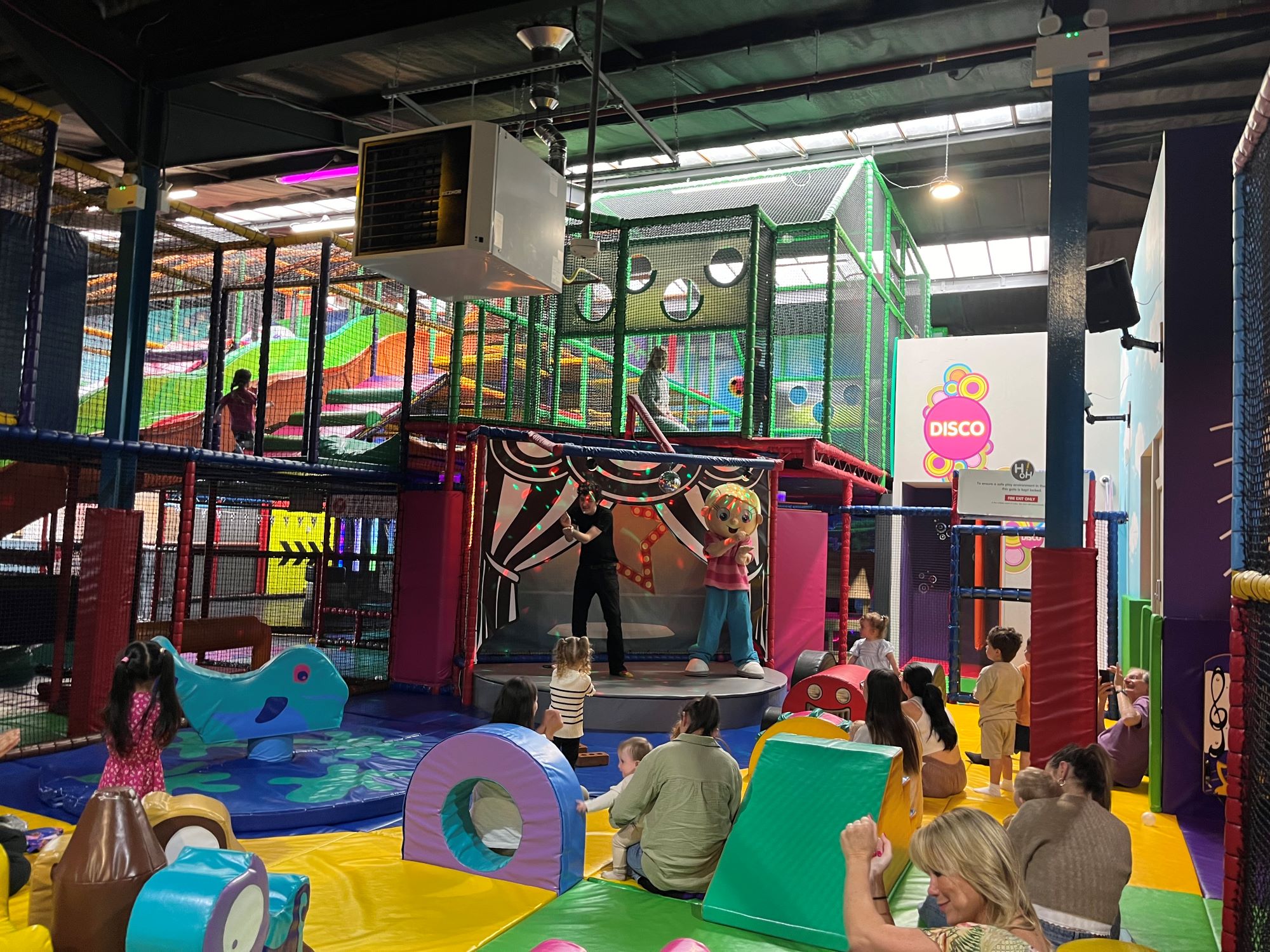 Indoor playground at KickSonic with colorful play structures for children's parties and gatherings