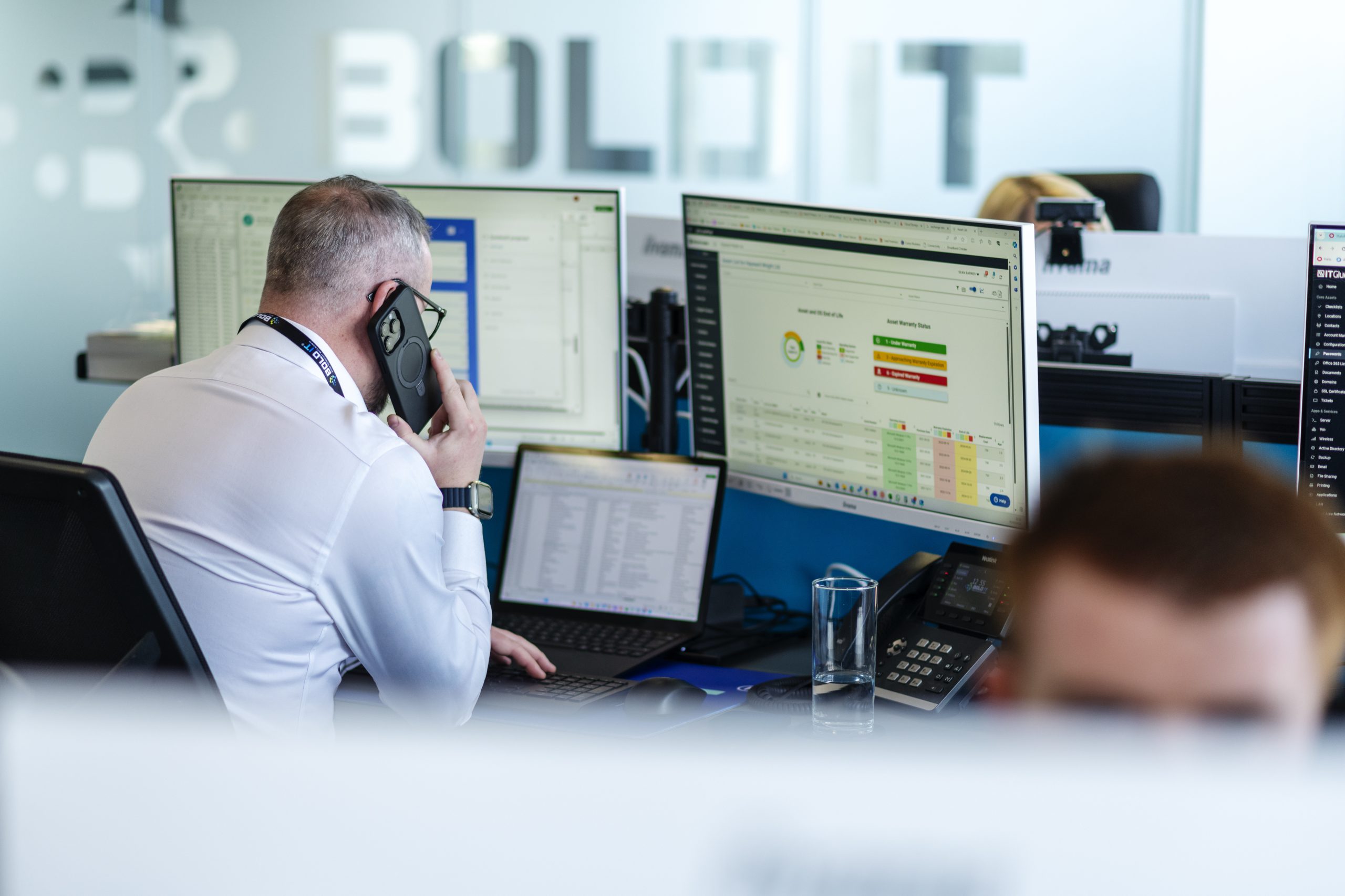 On-site support for corporate events with multitasking professional in busy office.