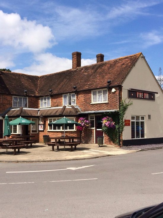 Charming pub in Vine Inn with outdoor seating for casual events and team gatherings.