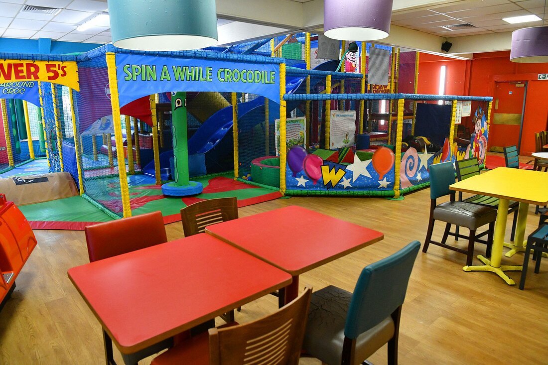 Vibrant indoor play area at Wacky Warehouse for children's birthday parties and events.