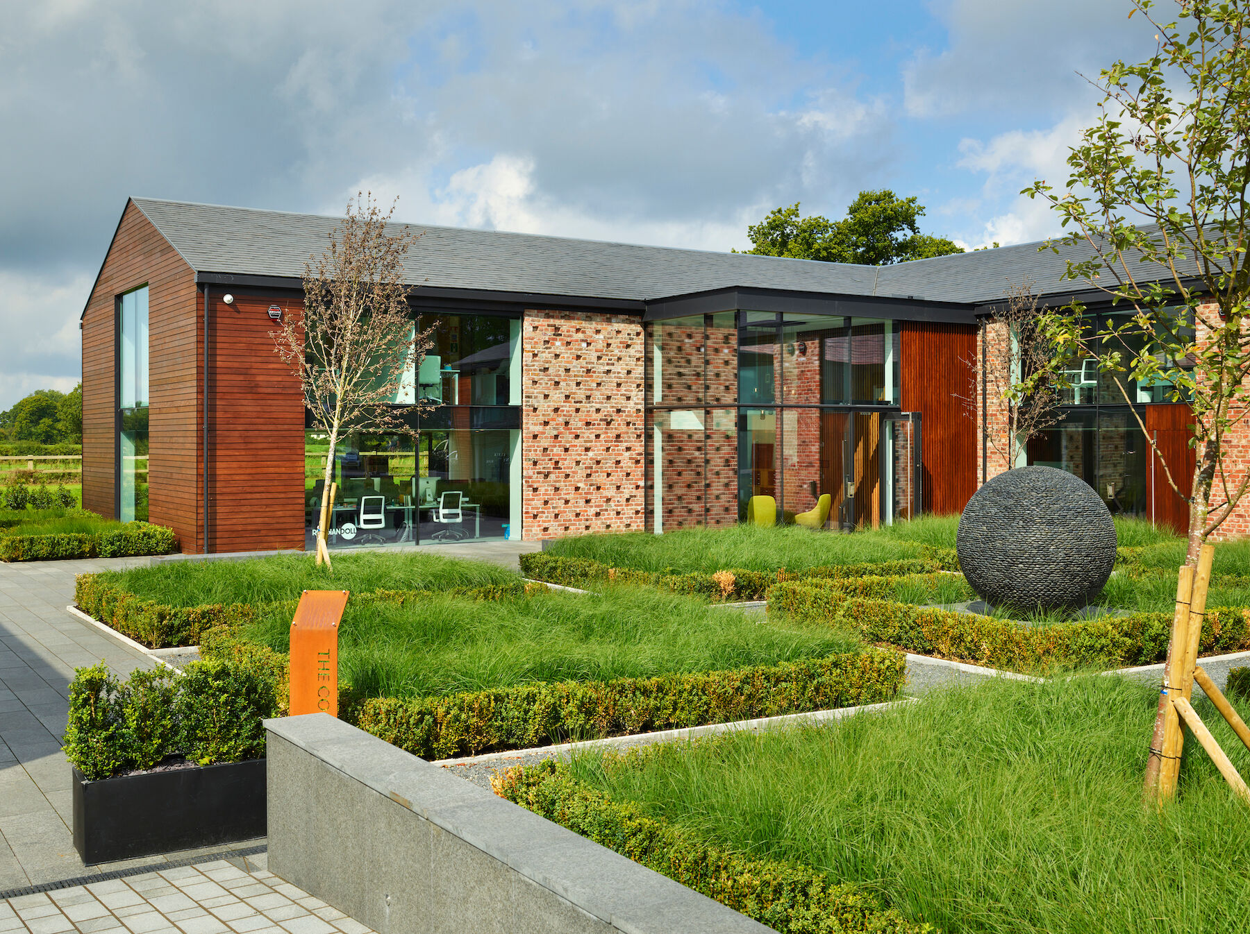 Modern meeting room venue in The Colony with large windows, perfect for corporate events.