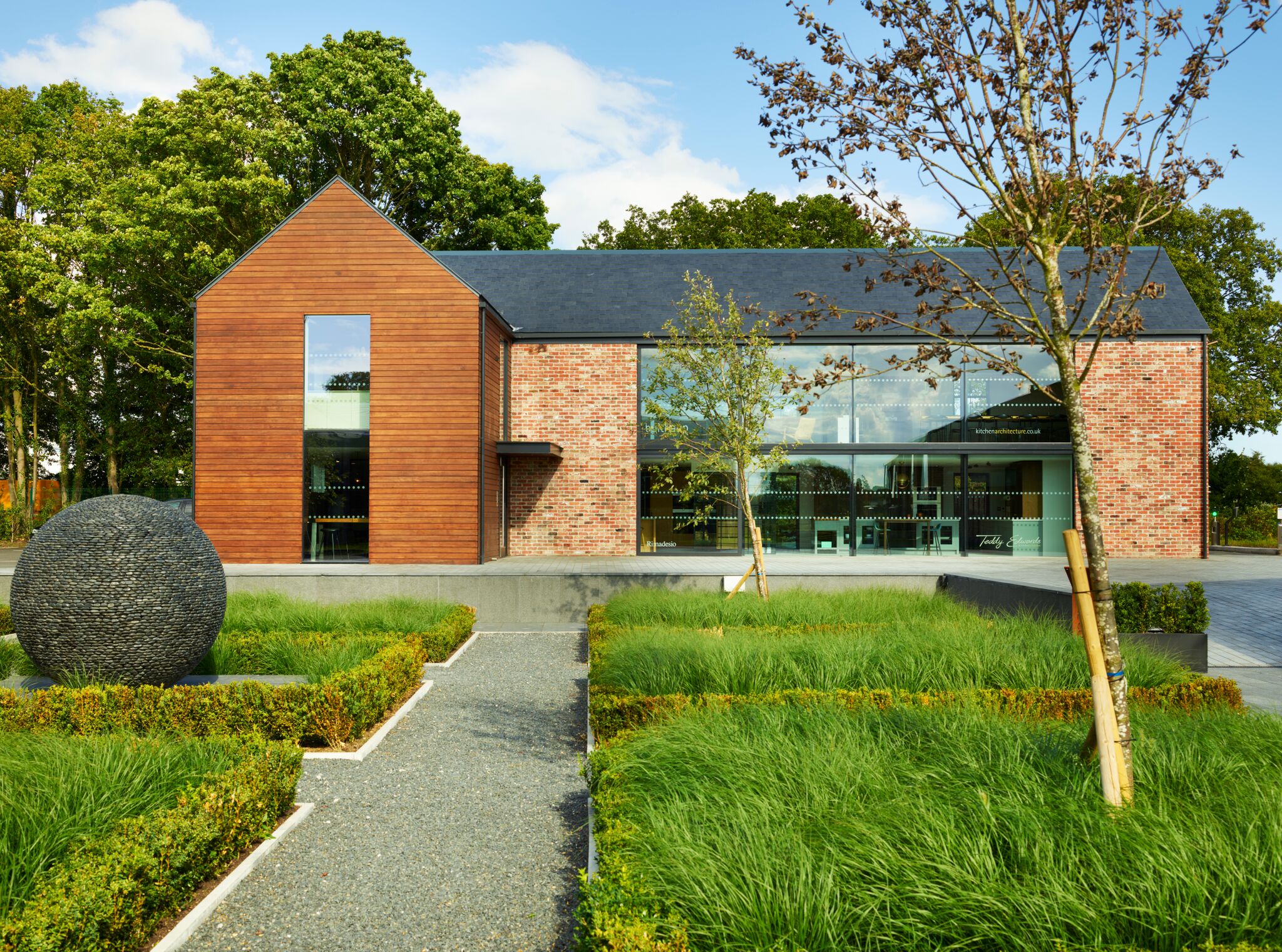 Modern event venue in Sector 6, featuring sleek wood and glass design, perfect for meetings.