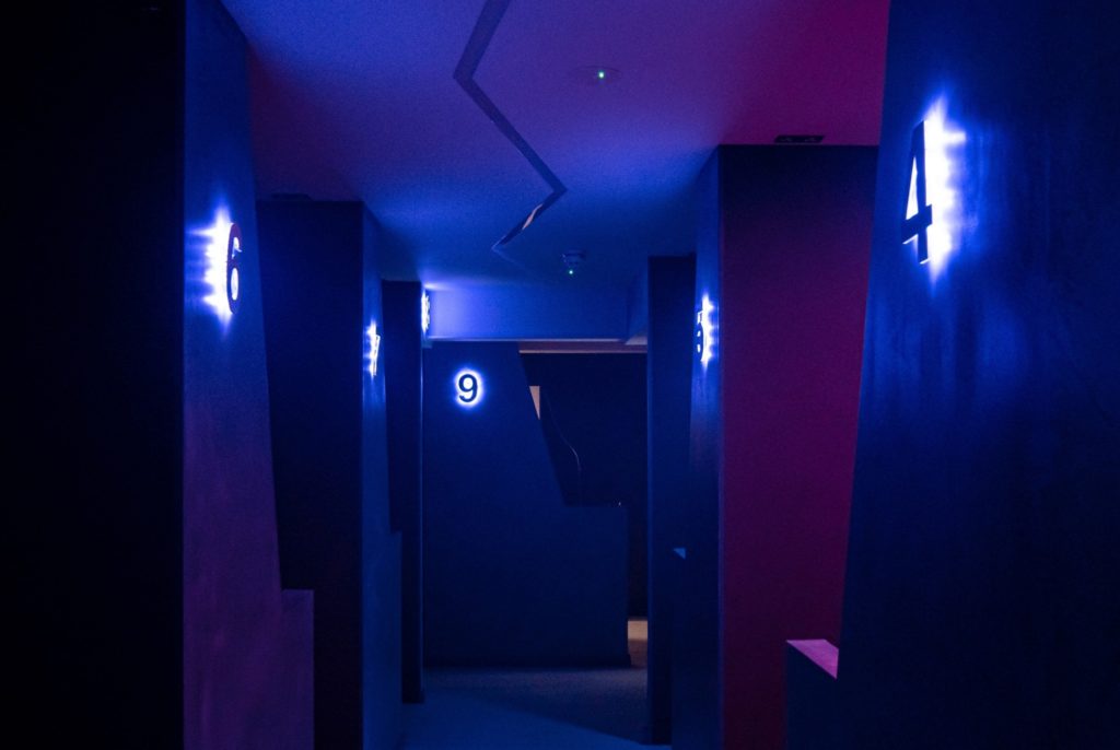 Ubisoft VR Escape Room at DNA VR, featuring illuminated corridors for networking events.
