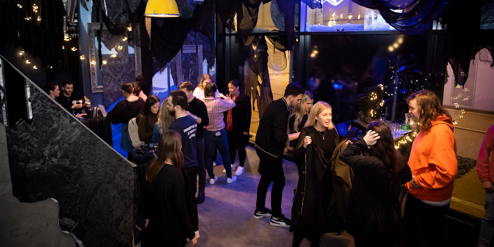 Ubisoft VR escape room networking event with vibrant decor and interactive atmosphere.