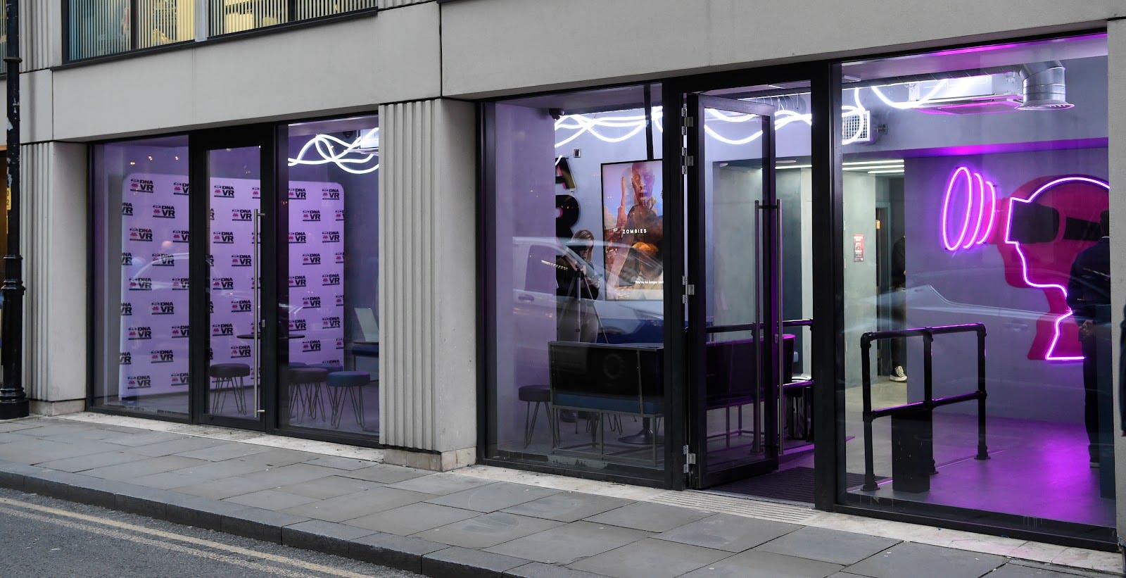 Modern event space with large windows, ideal for networking and presentations.