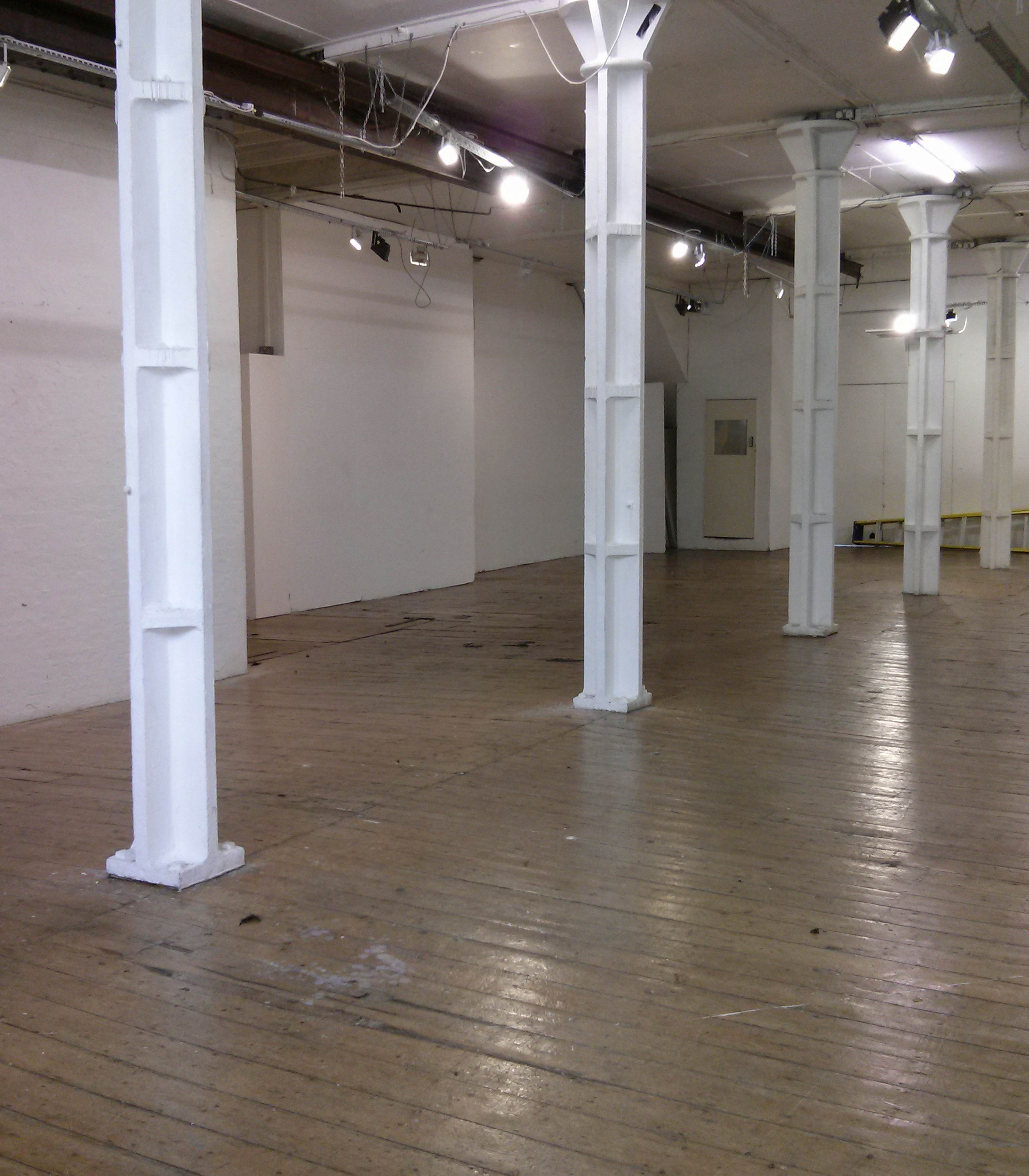 Spacious Ground Floor venue with wooden floors, ideal for events and meetings.