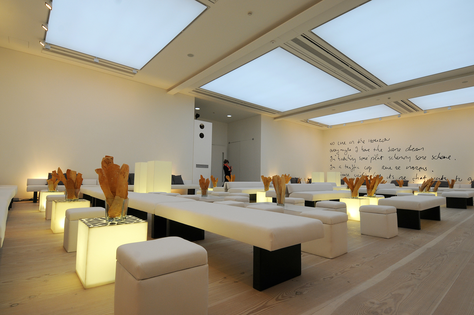 Modern event space with minimalist seating, perfect for presentations and gatherings.