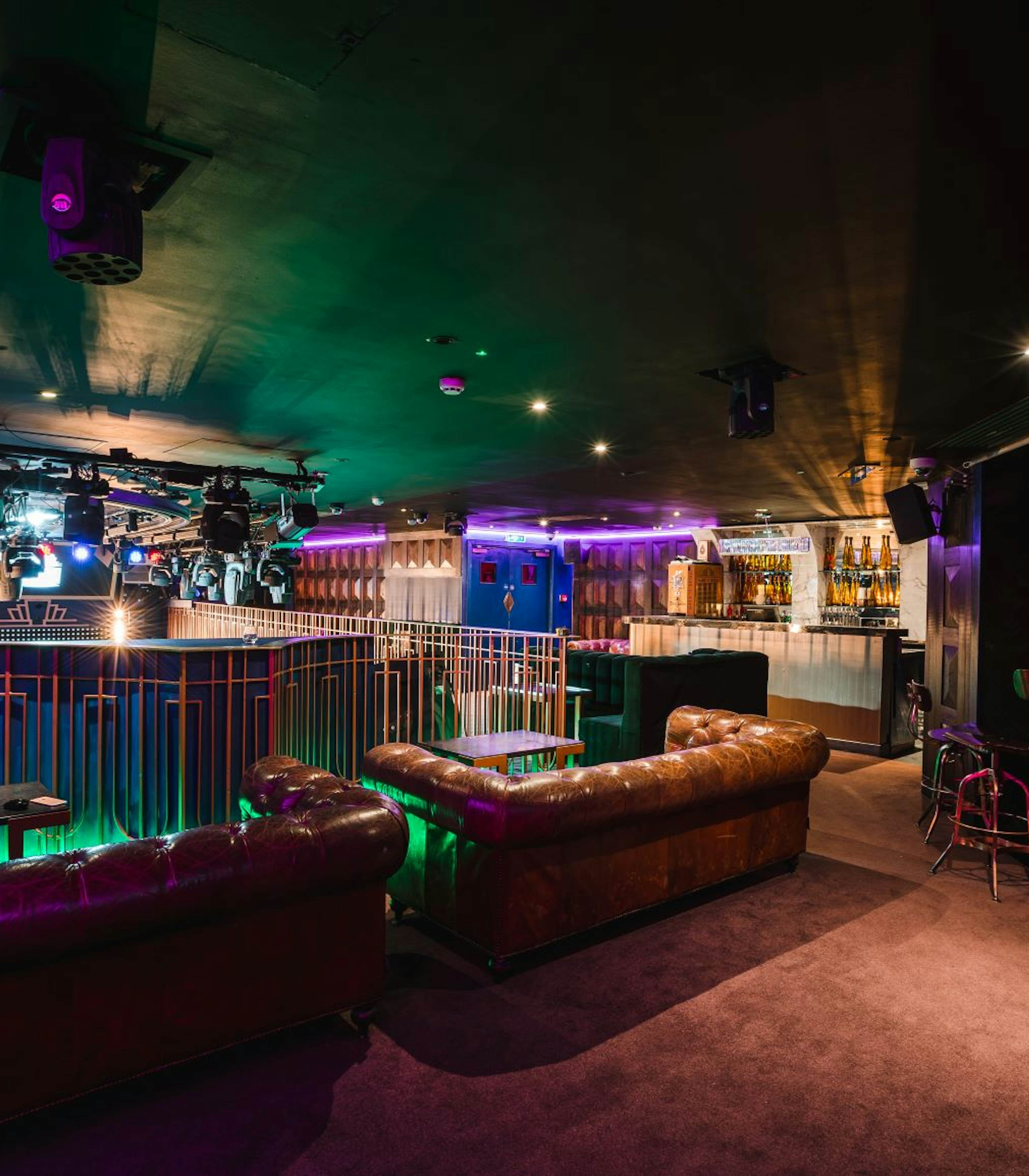 Modern event space with stylish lounge seating, perfect for corporate gatherings and celebrations.