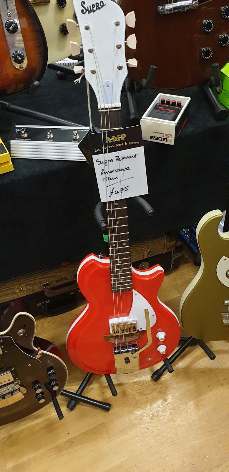 Vibrant red guitar display in Main Hall, perfect for music-themed events and entertainment.
