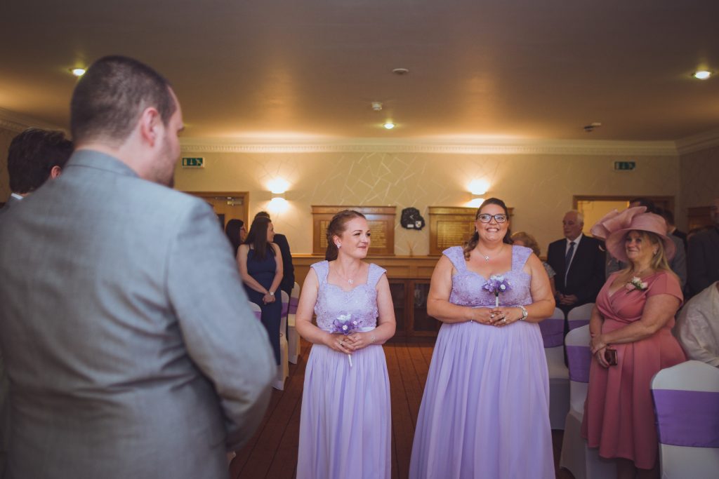 Mayoral Chamber in The Ashcroft with women in lavender dresses at a formal wedding event.