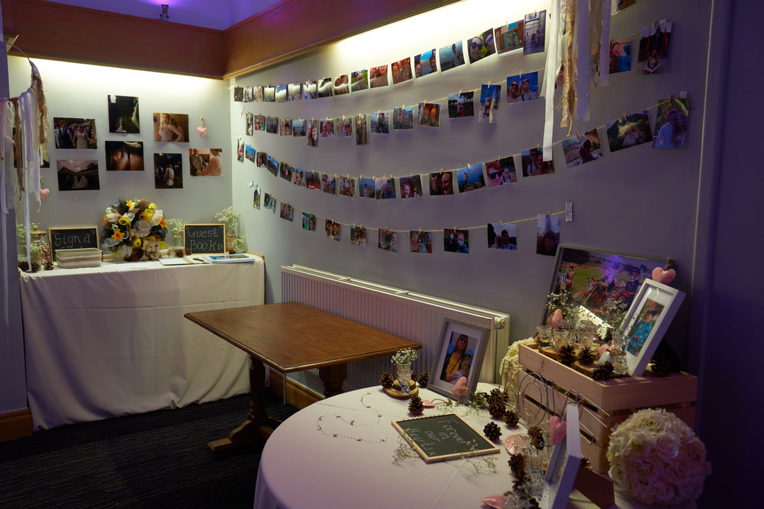 Charming function room with elegant decor, ideal for weddings and celebrations.