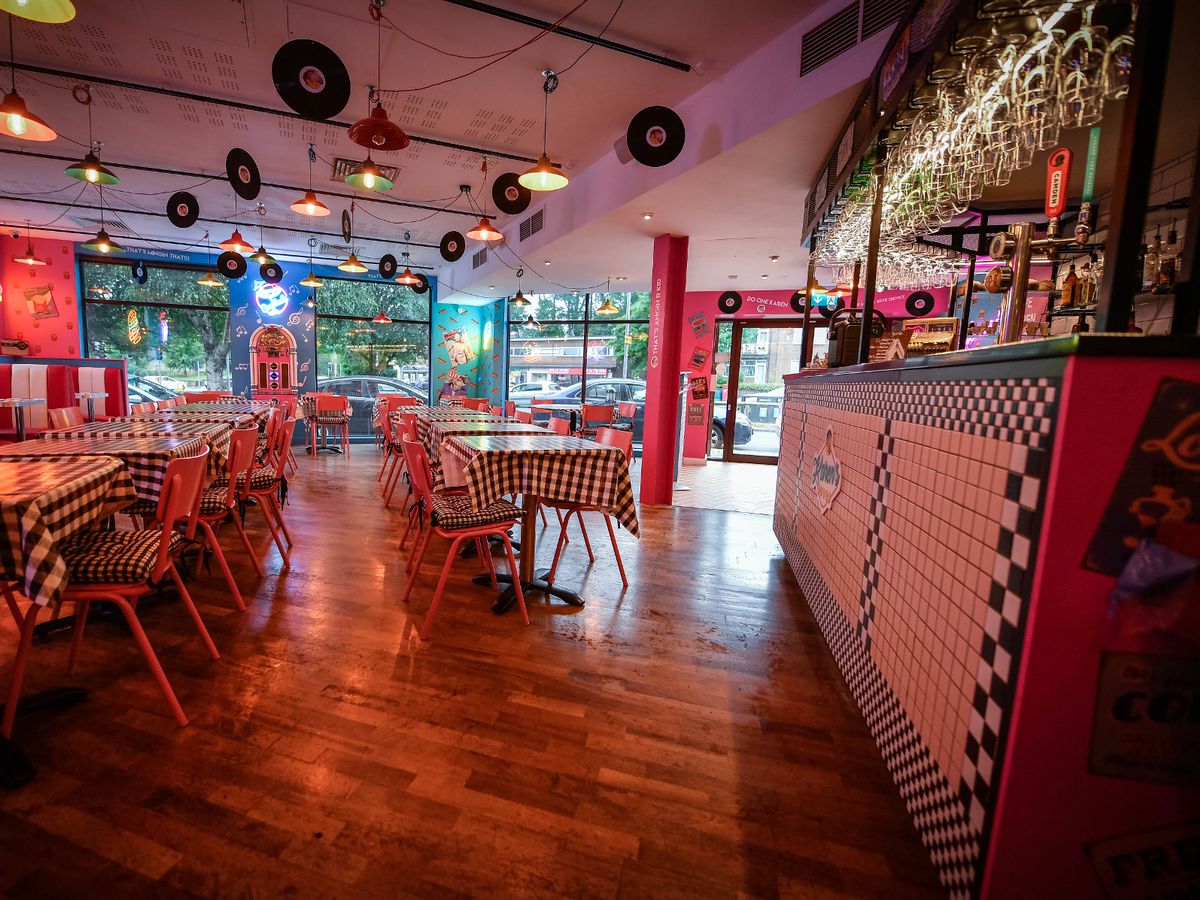 Vibrant dining area in Karen's Diner with retro decor for casual gatherings and events.