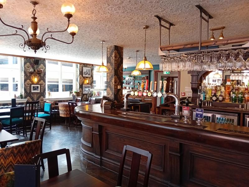 Cozy bar in Abel Heywood with vintage decor, ideal for networking events and gatherings.