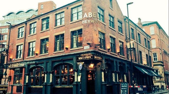 Inviting Abel Heywood pub with charming brick exterior, perfect for casual events.