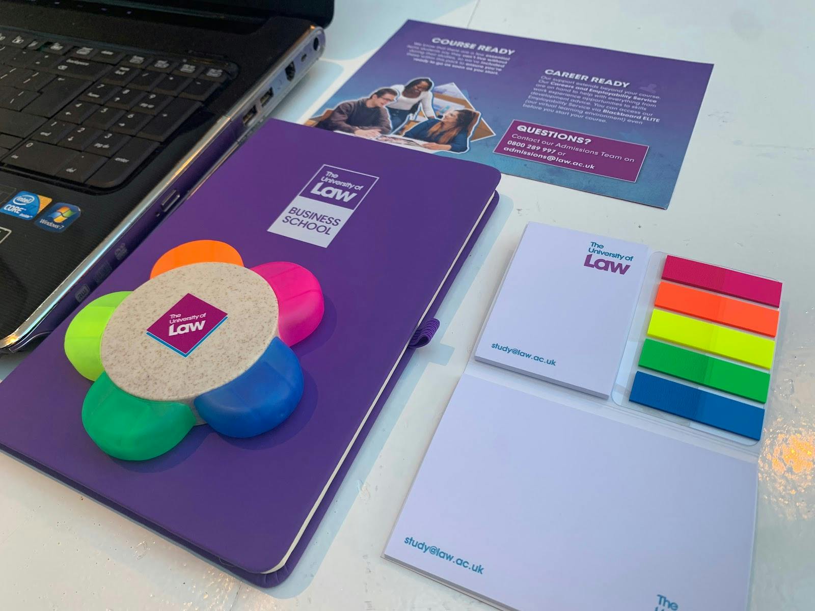 Library meeting setup with colorful notes and laptop for collaborative workshops.