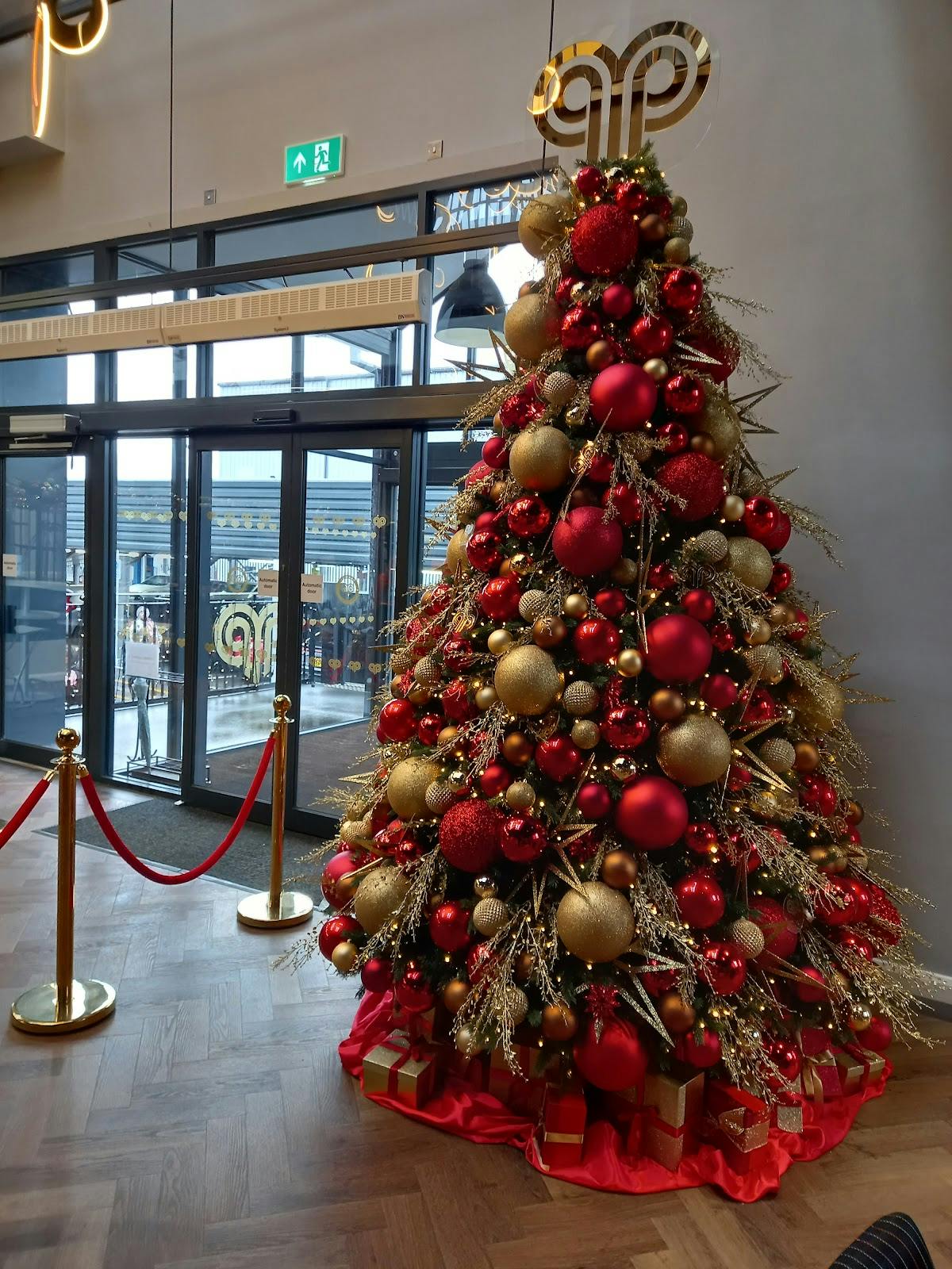 Christmas tree with red and gold ornaments in Ram Mill Business Centre event venue.