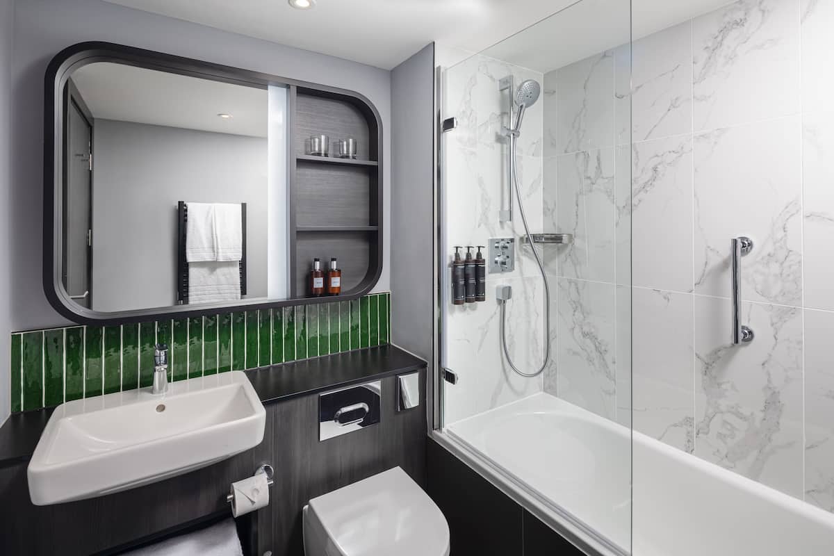 Modern hotel bathroom with marble accents at Residence Inn Manchester Piccadilly for events.