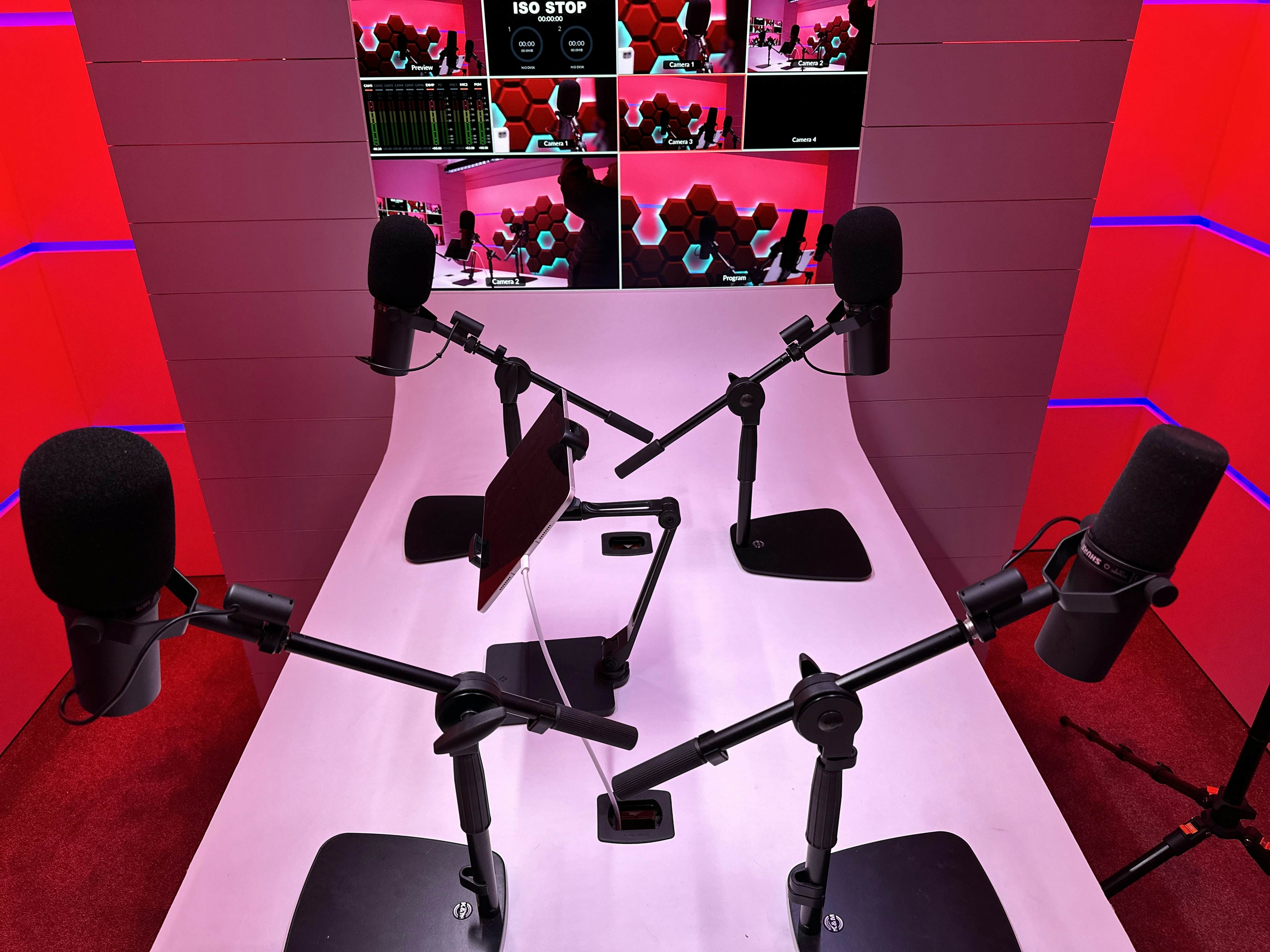 Modern podcast studio with multiple microphone stations, perfect for virtual events.