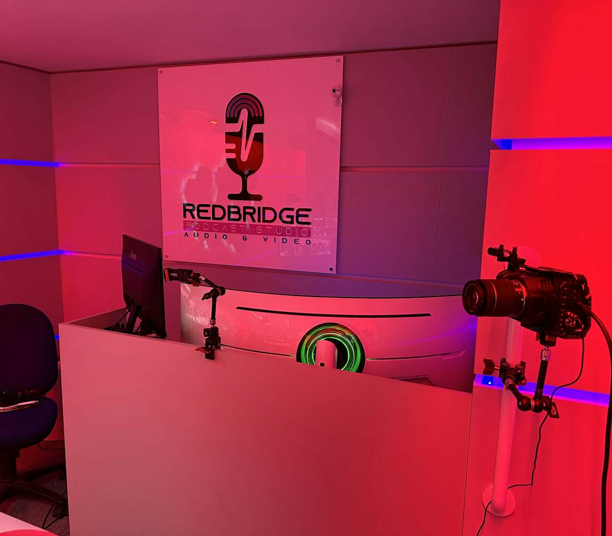 Modern rehearsal studio with vibrant lighting for hybrid meetings and webinars.