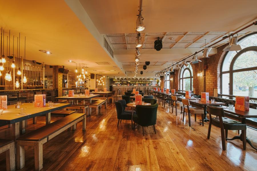 Private function room in All Bar One Manchester, versatile space for networking and events.