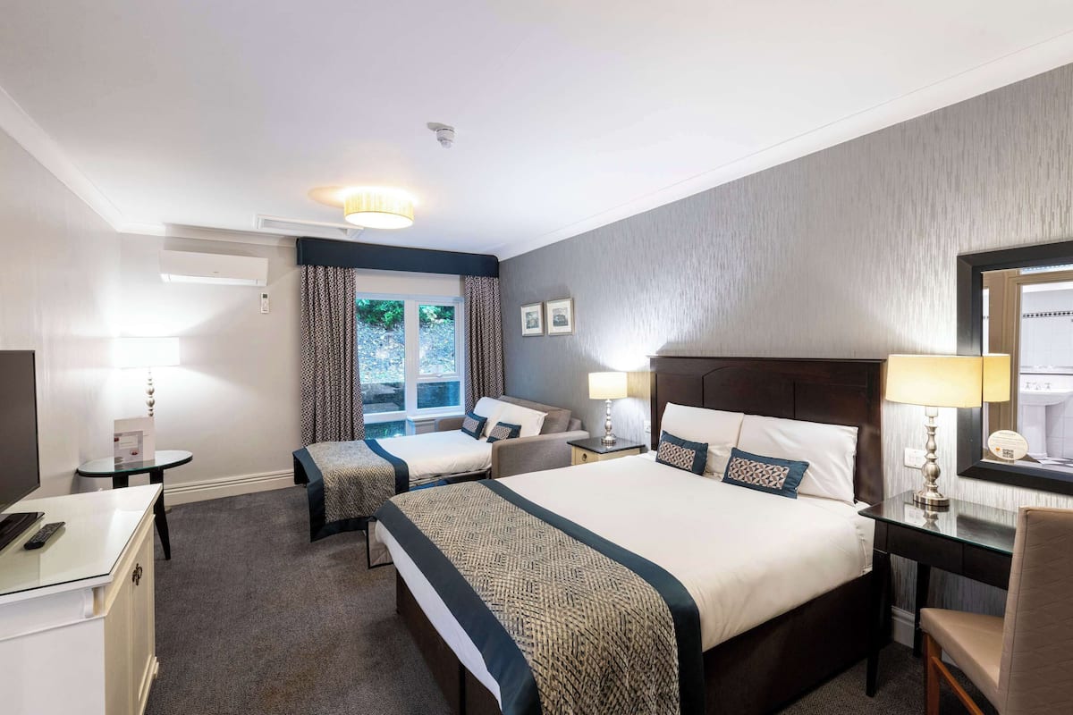 Hopwood Suite, Norton Grange Hotel: modern conference room with two beds and workspace.