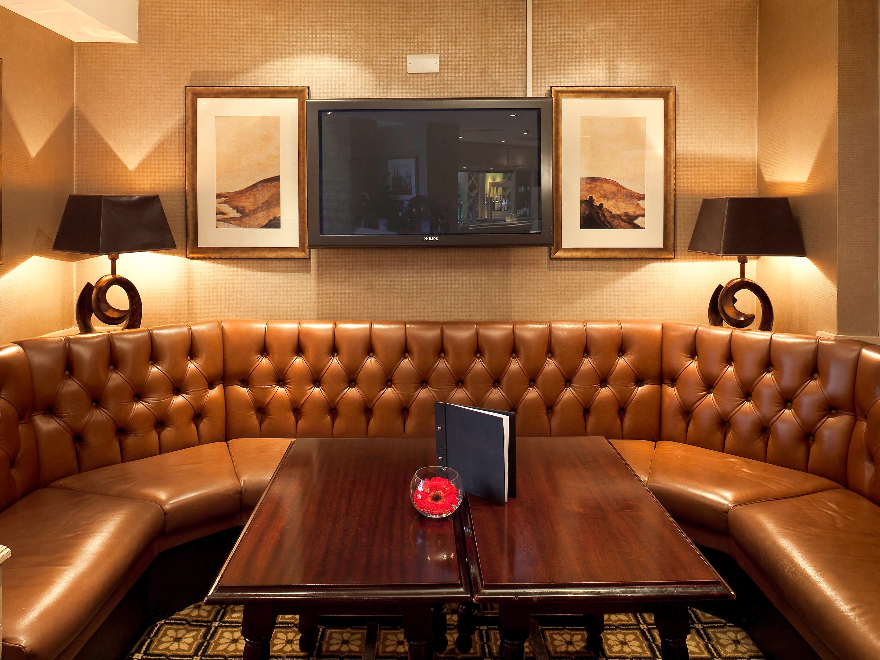 Elegant meeting space at Pickwick Bistro with leather seating, perfect for corporate events.