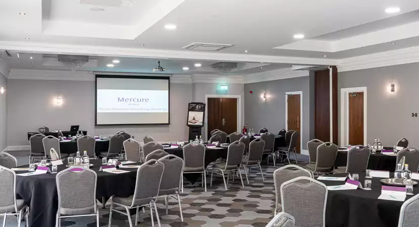 Private function room at Norton Grange Hotel, set up for a corporate seminar or workshop.