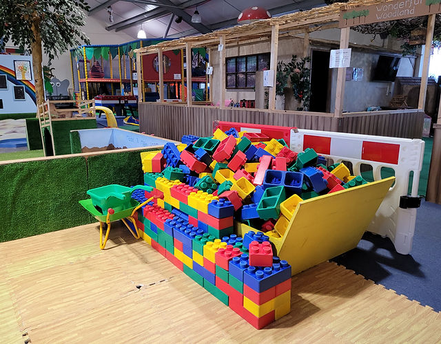Vibrant indoor playground with colorful blocks for children's events and family gatherings.