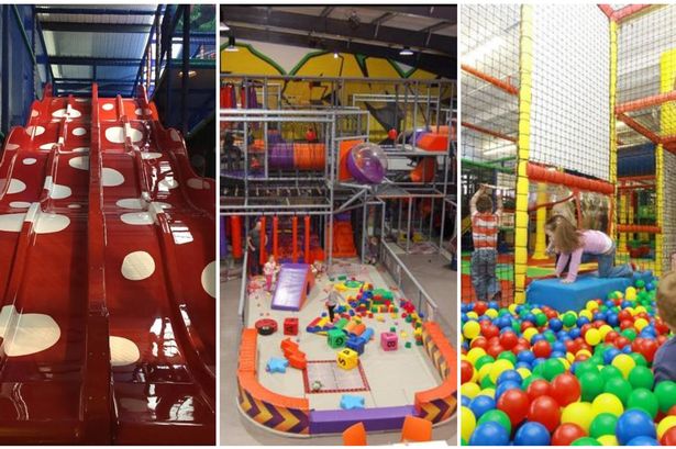 Vibrant indoor playground with slides for family-friendly children's parties.