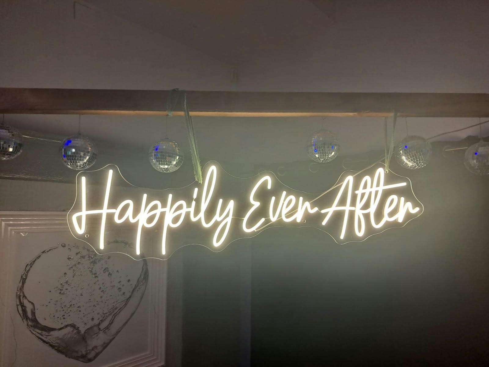 Neon "Happily Ever After" sign in Stanley House, perfect for weddings and romantic events.