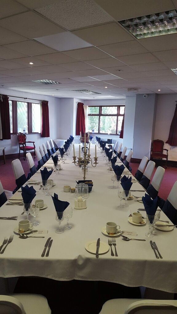 Elegant banquet setup in Windsor Suite, featuring candelabra, ideal for meetings and events.