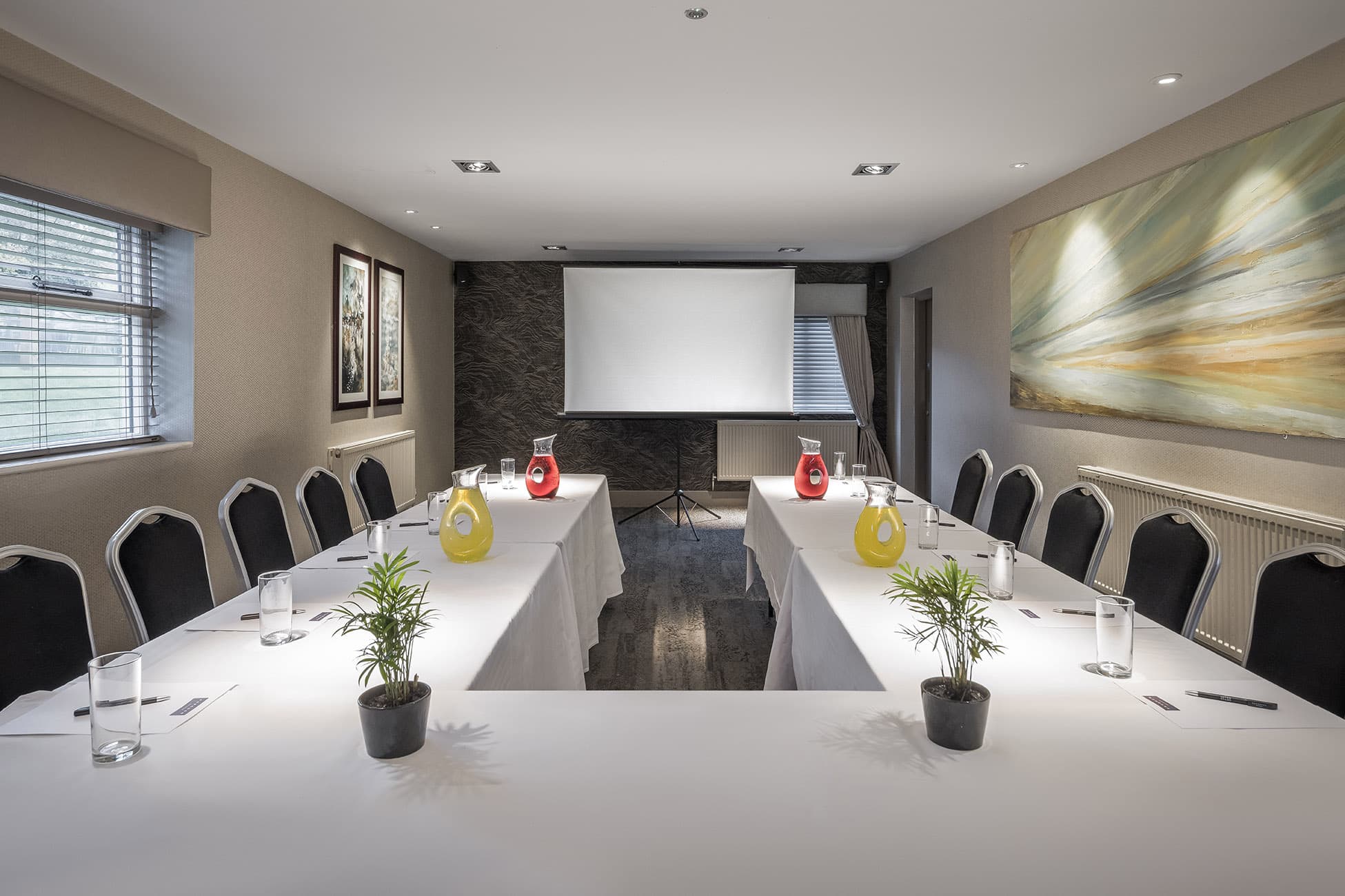 Coral Room at The Wayfarer: modern meeting space with U-shaped table and natural light.
