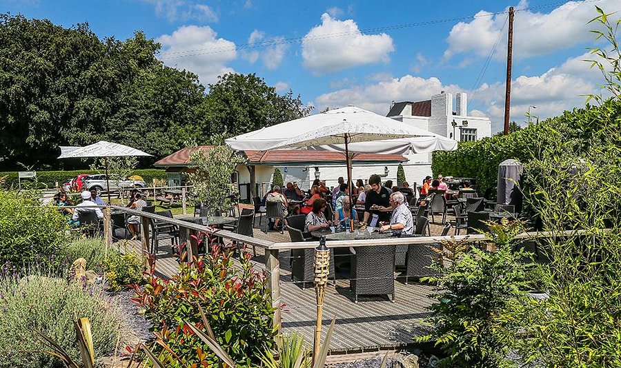 Outdoor bar at The Wayfarer with seating for corporate retreats and casual gatherings.