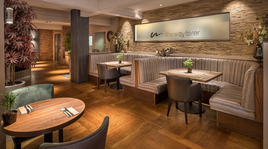 Contemporary bar area with warm wood tones, ideal for intimate gatherings and events.