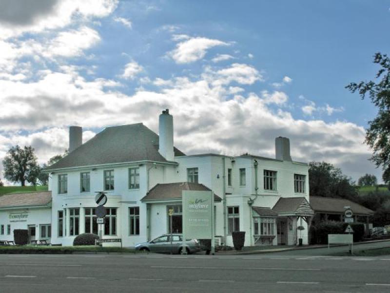 Charming Bar Area at The Wayfarer, elegant white exterior ideal for events and meetings.