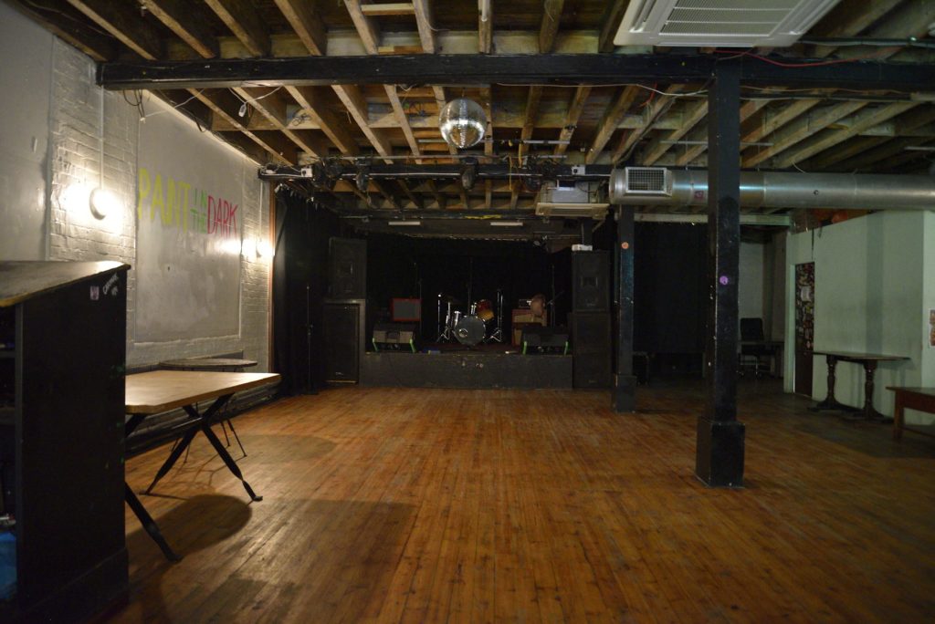 Versatile rehearsal space with wooden floors, ideal for corporate events and performances.