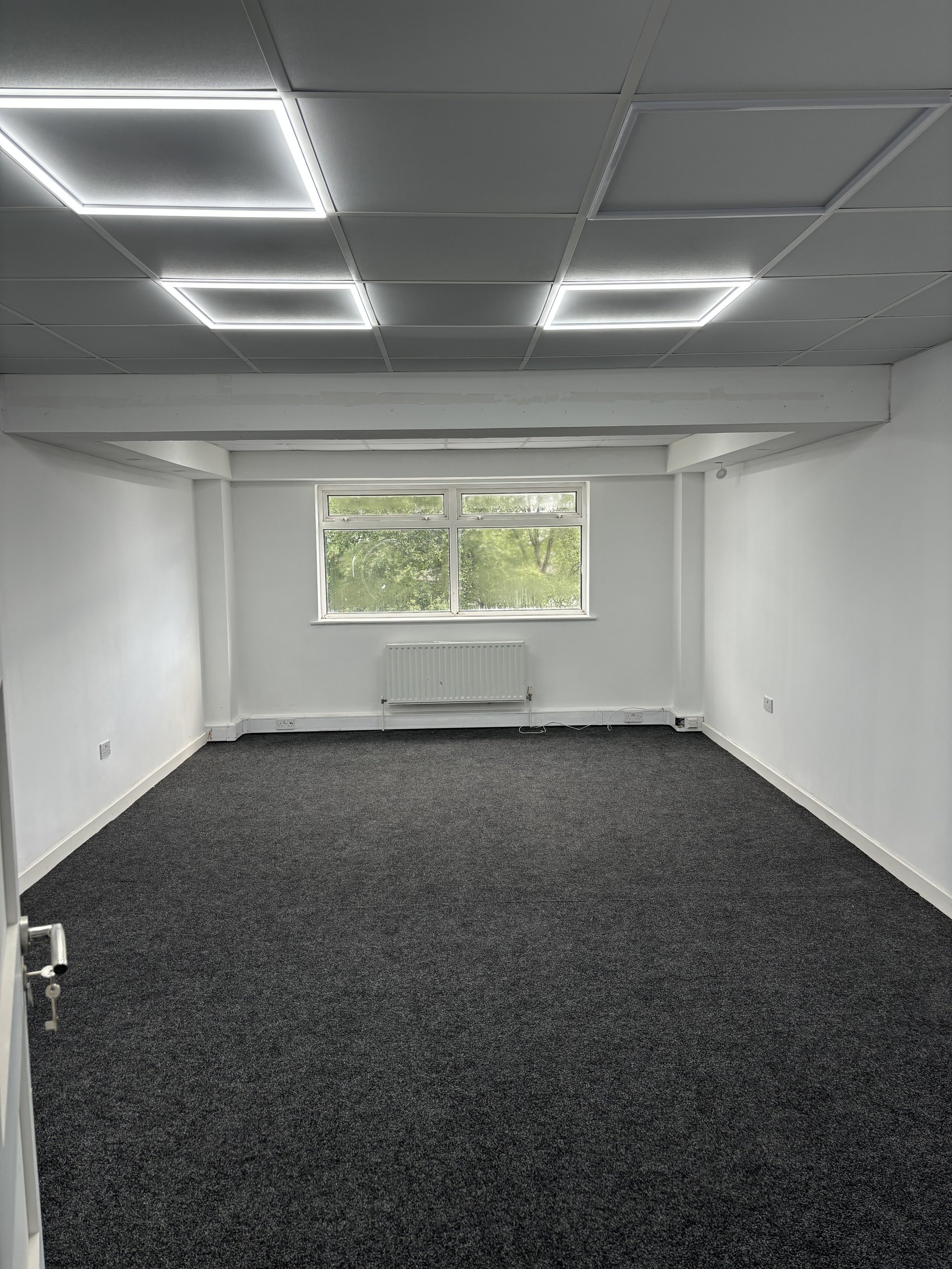 Rehearsal space at Elm Studios, bright with windows, ideal for workshops and conferences.