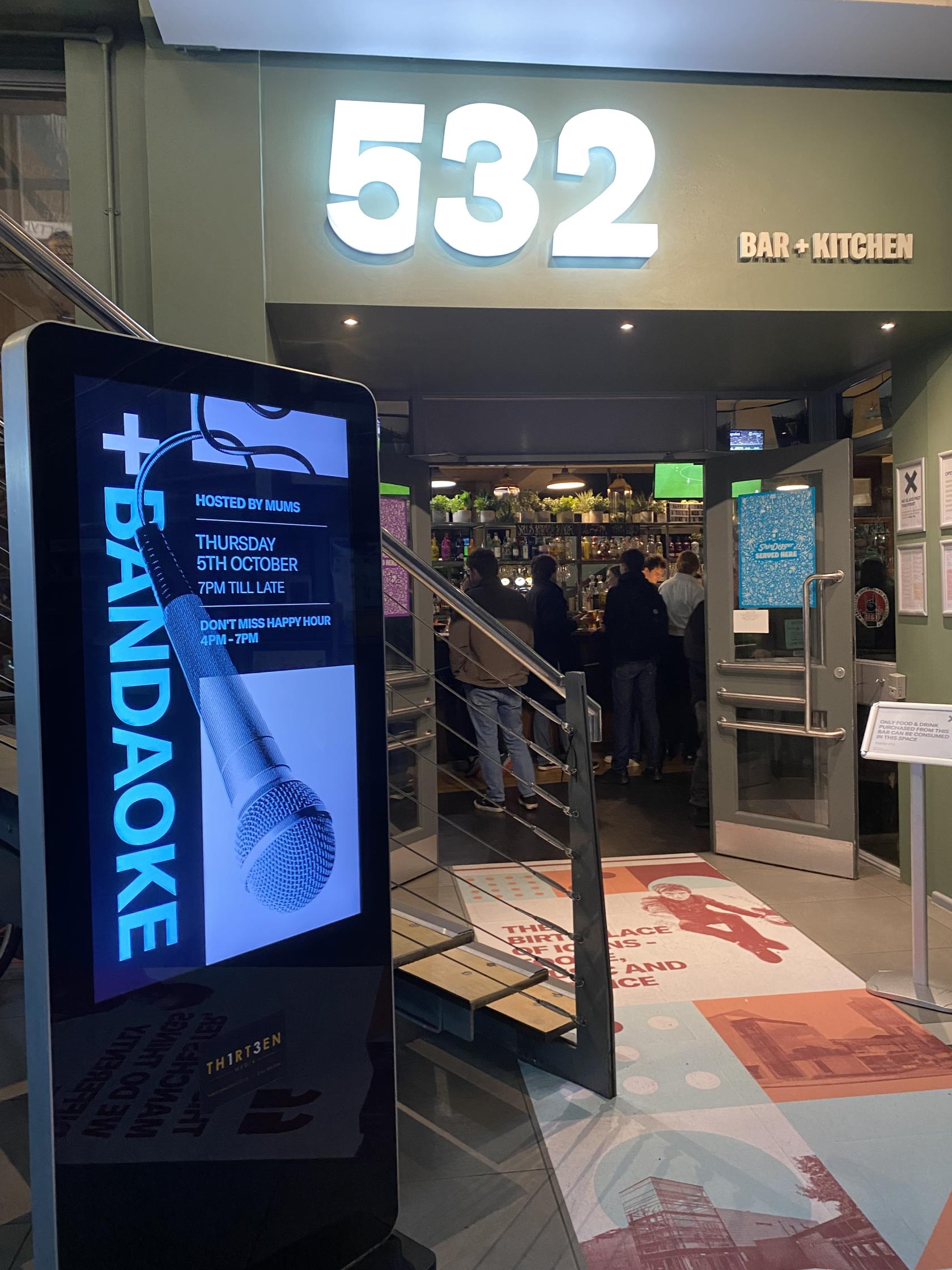 Vibrant bar entrance at 532 Bar + Kitchen for an upcoming karaoke event.