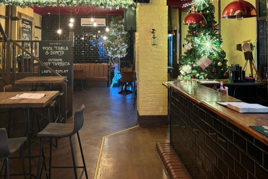 Spacious 532 Bar + Kitchen with festive decor, ideal for gatherings and events.