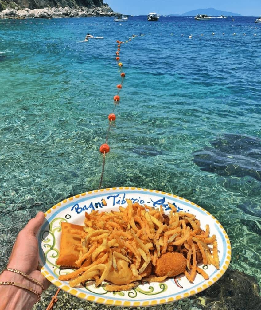 Bagni Tiberio at Capri Beach Club: crispy fries and stunning waterfront dining experience.