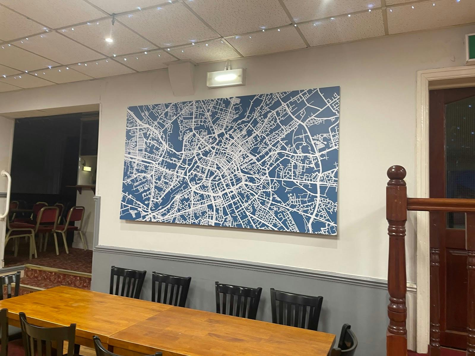 Party Room in St John’s Parish Centre with abstract map artwork for meetings and events.