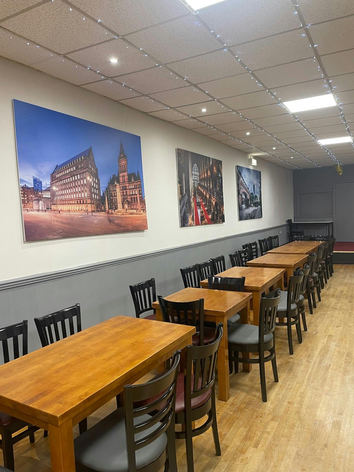 Flexible event space in St John's Parish Centre with long tables, ideal for meetings and gatherings.